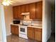 Kitchen with wood cabinets and appliances at 7217 Blannie Farms Ln, Willow Springs, NC 27592