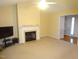 Living room with fireplace and carpet at 7217 Blannie Farms Ln, Willow Springs, NC 27592