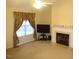 Living room with fireplace and large window at 7217 Blannie Farms Ln, Willow Springs, NC 27592