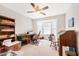 Bright home office with built-in shelving, window seat, and desk at 7217 Blannie Farms Ln, Willow Springs, NC 27592