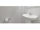 Simple pedestal sink in a small, bright bathroom at 80 Bella Vita Way, Angier, NC 27501