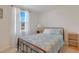 Bedroom with metal bed frame and patterned bedding at 80 Bella Vita Way, Angier, NC 27501