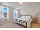 Spacious bedroom with a metal bed frame and large windows at 80 Bella Vita Way, Angier, NC 27501