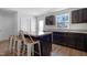 Kitchen with dark cabinets, stainless steel appliances, and an island at 80 Bella Vita Way, Angier, NC 27501