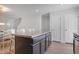 Kitchen island with seating overlooking the dining area at 80 Bella Vita Way, Angier, NC 27501
