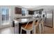 Kitchen with dark cabinets, stainless steel appliances, and an island with seating at 80 Bella Vita Way, Angier, NC 27501