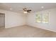 Spacious bedroom with carpet, ceiling fan and window at 829 Myrtle Grove Ln, Apex, NC 27502