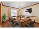 Dining room with hardwood floors and a large wooden table at 8420 Two Courts Dr, Raleigh, NC 27613