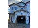 Unfinished three-story townhome with a two-car garage, under construction at 1115 Mountain Crown St, Durham, NC 27704