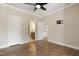 Hardwood floor bedroom with access to bathroom and hallway at 12309 Beestone Ln, Raleigh, NC 27614