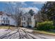 Two-story house with beige siding, maroon shutters, and a driveway at 1268 Miracle Dr, Wake Forest, NC 27587