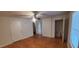 Hardwood floor bedroom with closet and access to other rooms at 1404 N Main St, Roxboro, NC 27573