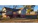 Back of the house with a deck and stairs leading to the yard at 1404 N Main St, Roxboro, NC 27573
