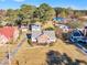 Brick house with a large front yard and American Flag at 205 E Main St, Micro, NC 27555