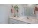 Bathroom boasts double sinks, quartz countertops, and a glass-enclosed shower at 2243 Horton Park Drive, Apex, NC 27539