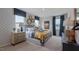 Main bedroom with bed, dresser, and geometric wallpaper at 2243 Horton Park Drive, Apex, NC 27539