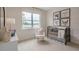 Bedroom with crib, rocking chair, and animal-themed wall art at 2243 Horton Park Drive, Apex, NC 27539