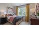 Bedroom with queen bed, dresser, and yellow curtains at 2243 Horton Park Drive, Apex, NC 27539