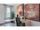 Bright home office features a large window, built-in desk, and stylish decor at 2243 Horton Park Drive, Apex, NC 27539