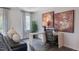 Bright home office with wood desk, large artwork, and window with curtains at 2243 Horton Park Drive, Apex, NC 27539