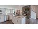 Open concept kitchen with island and stainless steel appliances at 2243 Horton Park Drive, Apex, NC 27539