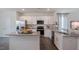 Modern kitchen with stainless steel appliances and granite countertops at 2243 Horton Park Drive, Apex, NC 27539