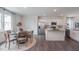 Bright kitchen with island, stainless steel appliances, and dining area at 2243 Horton Park Drive, Apex, NC 27539
