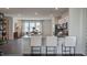 Modern kitchen with island, white cabinets, and stainless steel appliances at 2243 Horton Park Drive, Apex, NC 27539