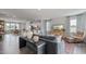 Living room with open floor plan, showcasing kitchen and dining area at 2243 Horton Park Drive, Apex, NC 27539