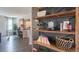 Stylish wooden shelving unit with books, decor, and wine storage at 2243 Horton Park Drive, Apex, NC 27539