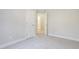 Simple bedroom with grey carpet, and an ensuite bathroom at 25 Porters Glen Pl, Durham, NC 27713