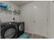 Laundry room with washer, dryer, and ample shelving at 274 E Boulder Road, Henderson, NC 27537
