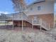 House with a large deck and stairs leading to the backyard at 302 N Montreal Ct, Cary, NC 27511