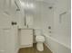 Clean bathroom with white subway tile, a white vanity, and a bathtub at 302 N Montreal Ct, Cary, NC 27511