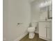 Clean and modern half bathroom with white vanity and updated fixtures at 302 N Montreal Ct, Cary, NC 27511