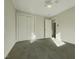 Bright bedroom with carpet flooring and ample closet space at 302 N Montreal Ct, Cary, NC 27511