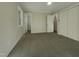 Spacious bedroom with carpet flooring and access to a bathroom at 302 N Montreal Ct, Cary, NC 27511