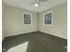Bright bedroom with neutral walls, carpet flooring, and large windows at 302 N Montreal Ct, Cary, NC 27511