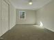 Spacious bedroom with carpeted floors and ample natural light at 302 N Montreal Ct, Cary, NC 27511