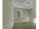 Well-lit bedroom with neutral walls and carpet flooring at 302 N Montreal Ct, Cary, NC 27511