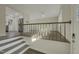Entryway with stairs leading up to the living area and kitchen at 302 N Montreal Ct, Cary, NC 27511