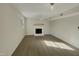 Spacious living room featuring a fireplace and hardwood floors at 302 N Montreal Ct, Cary, NC 27511