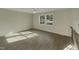 Bright living room with hardwood floors and large windows at 302 N Montreal Ct, Cary, NC 27511