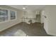 Open living room with hardwood floors, high ceilings, and view of upper level at 302 N Montreal Ct, Cary, NC 27511