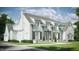 Two-story home with white brick exterior, gray shutters, and a landscaped lawn at 3358 Hampton Rd, Raleigh, NC 27607