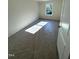 Spacious bedroom with neutral walls and carpet, featuring three windows at 430 La Maison Ave # 12, Wendell, NC 27591