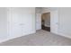 Spacious bedroom with double doors leading to a hallway and another room at 51 Sunburst Ct, Fuquay Varina, NC 27526