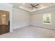 Large bedroom with carpeted floors and a ceiling fan at 51 Sunburst Ct, Fuquay Varina, NC 27526