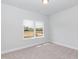Bright bedroom with carpeted floor and a large window offering natural light at 51 Sunburst Ct, Fuquay Varina, NC 27526