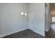 Bright dining room with hardwood floors and a modern light fixture at 51 Sunburst Ct, Fuquay Varina, NC 27526